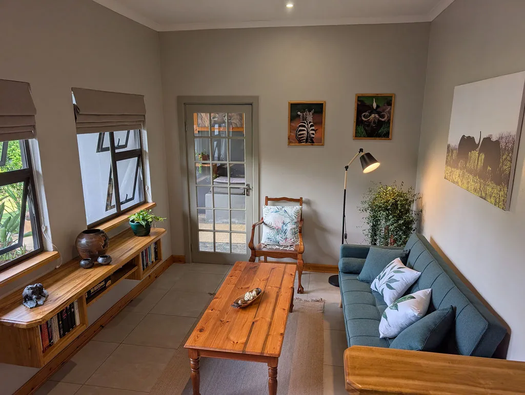 Lounge with sofa and garden-facing windows at The Wood Haven