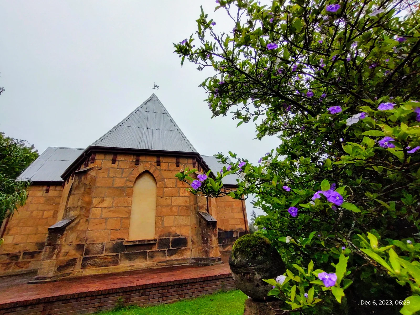 The church garden and stone side wall