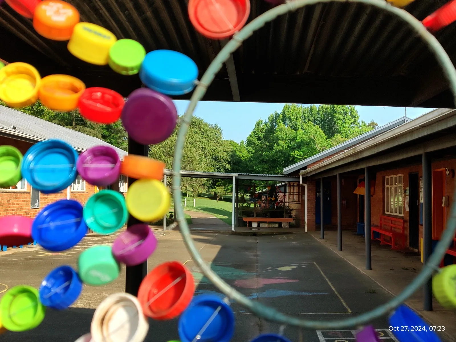 A view through school courtyard artwork
