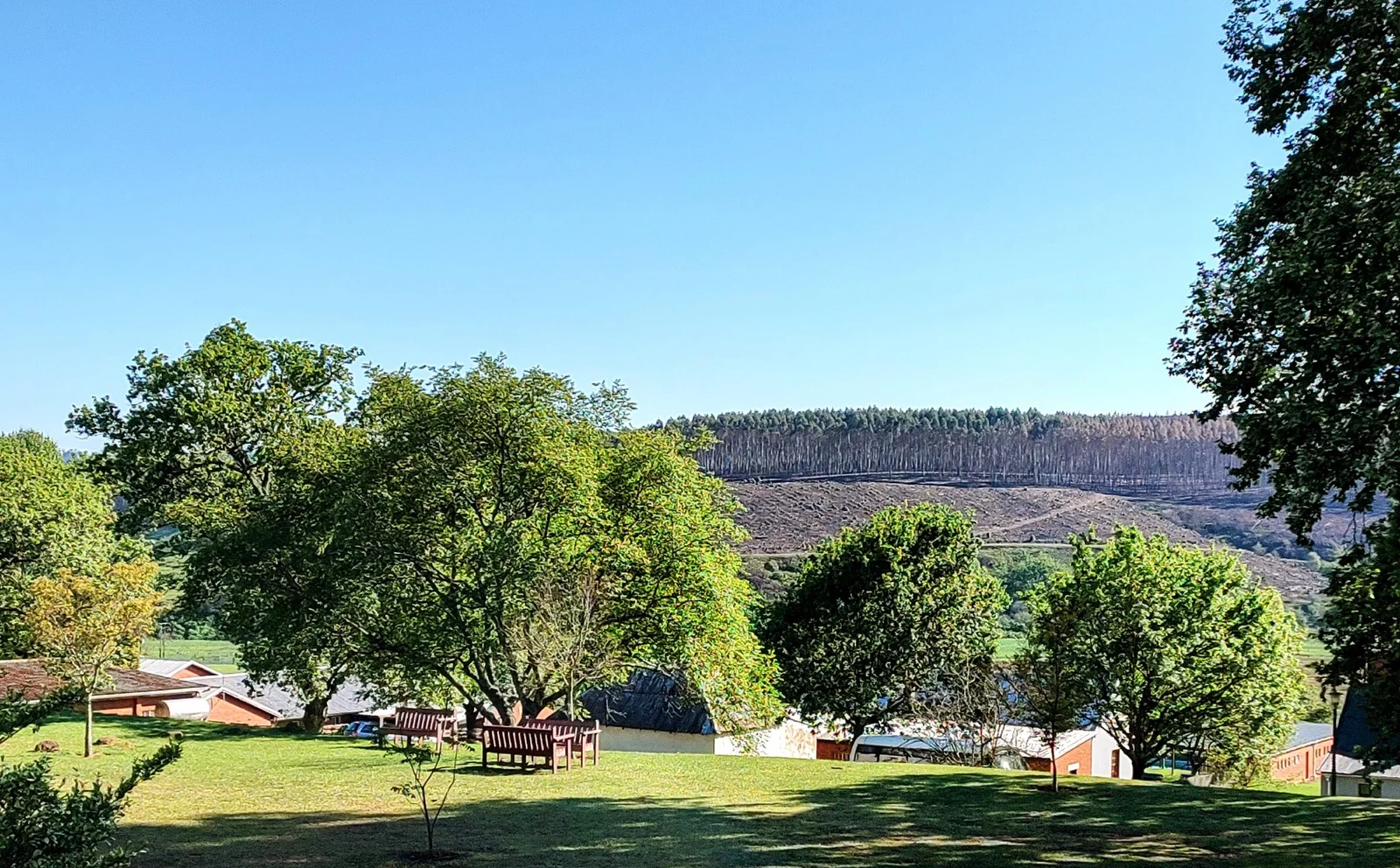 Village grounds with hills beyond